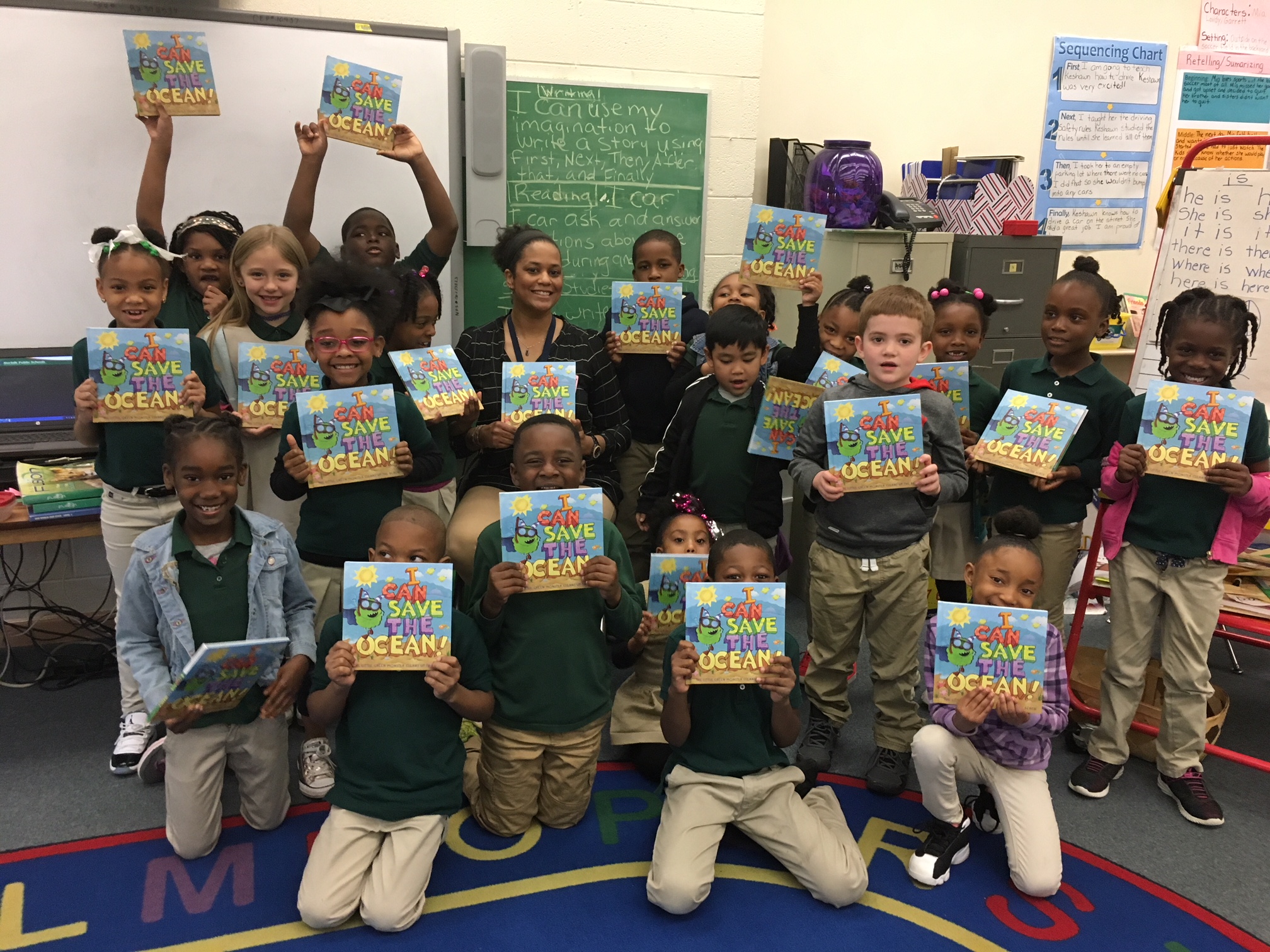School Class Holding Books "I Can Save the Ocean"